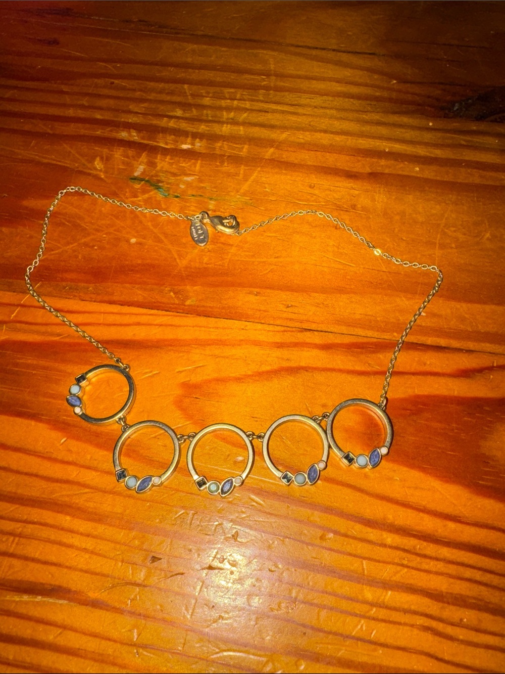 Gold Tone Circles Necklace with Blue Accent Stones